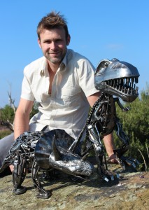 Andy Shaw, photo of artist with Dinosaur Sculptures